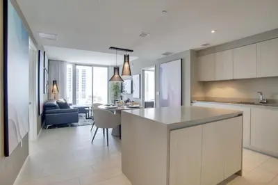 an open kitchen and living room with a dining room at Upscale Condo with Pool Access in Hyde Beach House! in Hollywood