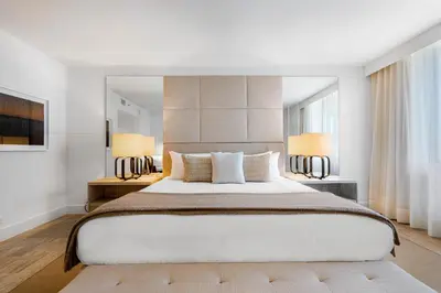 a bedroom with a large bed and two lamps at Oceanview Private Condo at 1 Hotel & Homes -1115 in Miami Beach