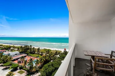 a balcony with a view of the beach and ocean at Oceanview Private Condo at 1 Hotel & Homes -1115 in Miami Beach