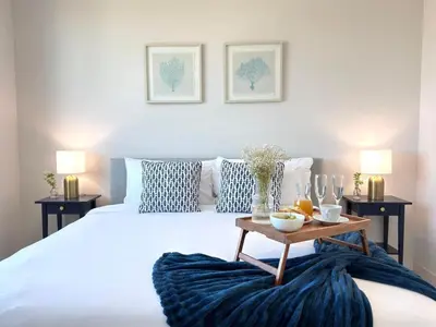 a bedroom with a large bed with a table on it at Desing district, great apartment in Miami
