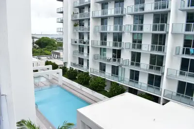 an aerial view of a building with a swimming pool at Desing district, great apartment in Miami