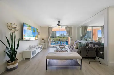a living room with a couch and a table at Yacht Club at aventura Amazing Marina view parking included in Miami