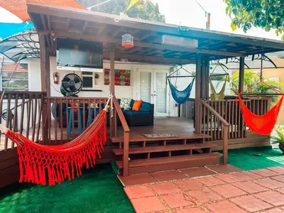 a gazebo on a deck with hammocks at Hammocks & mini-golf! 10 mins from Beach! in Hollywood