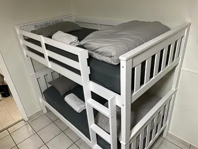 a white bunk bed in a room at Single Size BOTTOM Bunk Bed - Mixed Shared ROOM in Miami