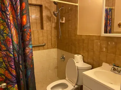 a bathroom with a toilet and a sink at Single Size BOTTOM Bunk Bed - Mixed Shared ROOM in Miami