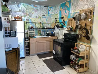 a kitchen with a refrigerator and a stove at Single Size BOTTOM Bunk Bed - Mixed Shared ROOM in Miami