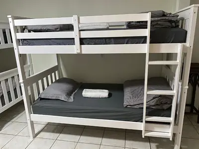 a room with two bunk beds with a bed at Single Size TOP Bunk Bed - Mixed Shared ROOM in Miami