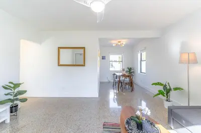 a living room with a couch and a table at Renovated Apts with Kitchen, Fast WiFi, Smart TV, Roku & Pool Onsite 4 mi to Surfside Beach in North Miami