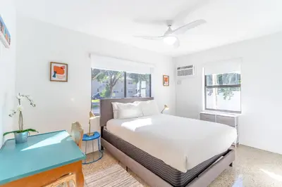 a bedroom with a bed and a window at Renovated Apts with Kitchen, Fast WiFi, Smart TV, Roku & Pool Onsite 4 mi to Surfside Beach in North Miami