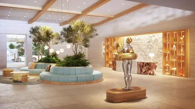 a lobby with a statue of a woman in a fountain at The Sunny in Sunny Isles Beach