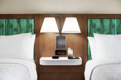 a hotel room with two beds and a nightstand between them at Hampton Inn & Suites Miami, Kendall, Executive Airport in Kendall