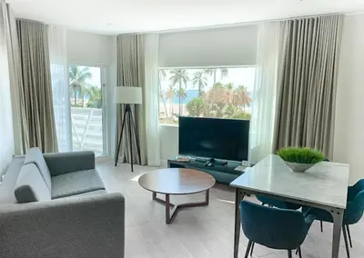 a living room with a couch and a table at B Ocean Resort Fort Lauderdale Beach in Fort Lauderdale