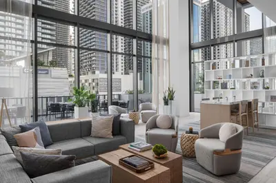 a living room with large windows and couches at Element Miami Brickell in Miami