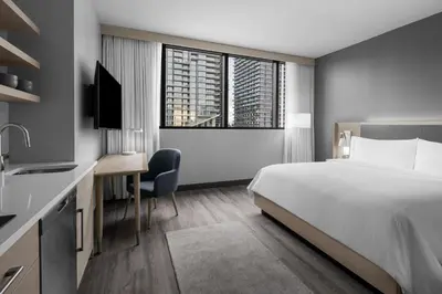 a hotel room with a bed and a desk at Element Miami Brickell in Miami