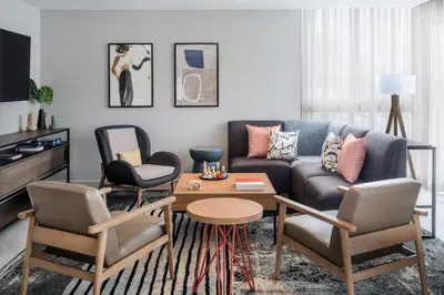 a living room with a couch and two chairs at Atwell Suites Miami Brickell by IHG in Miami
