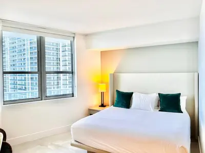 a bedroom with a white bed and a window at Dramatic Ocean View at Hyde Resort And Residences in Hollywood