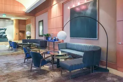 a waiting room with couches and tables and a chalkboard at Live the Miami Experience in an Exclusive Condo 4S in Miami