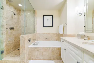 a bathroom with a shower and a sink and a tub at Live the Miami Experience in an Exclusive Condo 4S in Miami
