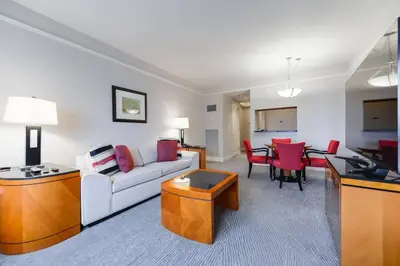 a living room with a white couch and red chairs at Live the Miami Experience in an Exclusive Condo 4S in Miami