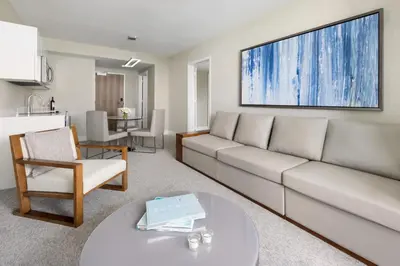 a living room with a couch and a table at The Altair Bay Harbor Hotel in Miami Beach