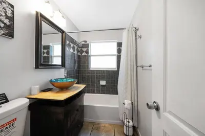 a bathroom with a wooden bowl on a wooden counter at Home wpool by PMI unit 401 in Fort Lauderdale