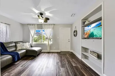 a living room with a couch and a tv at Home wworkstation by PMI unit 2908 in Hollywood