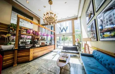 a lobby of a restaurant with a blue couch at *ICONIC W ICON CONDO/ POOL&WATERVIEWS*FREESPA* in Miami