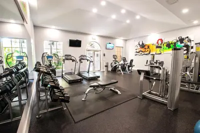a gym with several treadmills and cardio machines at Yacht Club Newly renovated parking included in Aventura