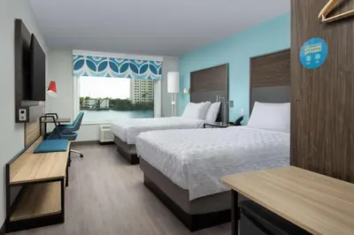 a hotel room with two beds and a window at Tru By Hilton Miami Airport South Blue Lagoon, Fl in Miami