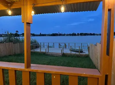 a view of the water from the porch of a house at SuperVilla - Lakefront - Sunsets, Kayaks, Grill in Fort Lauderdale