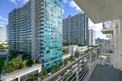 arial view of a tall building in a city at Relax Family Midtown - free parking & Great pool in Miami