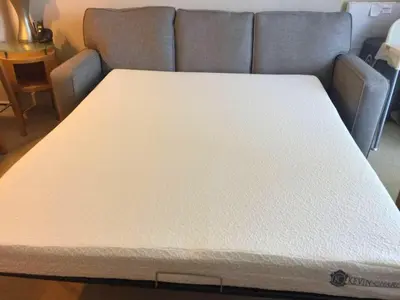 a bed in a room with a couch at MVR Apartments at Marenas in Miami Beach