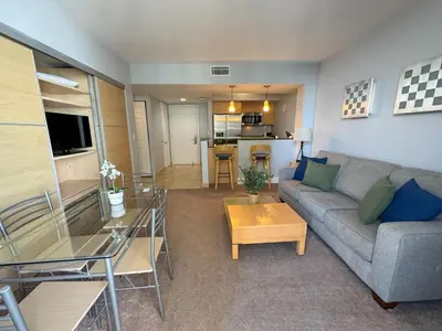 a living room with a couch and a table at MVR Apartments at Marenas in Miami Beach