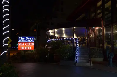 a sign for a sea club hotel at night at Sea Club Ocean Resort in Fort Lauderdale