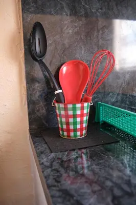 a container of utensils sitting on a counter at Little Havana Executive 11 in Miami