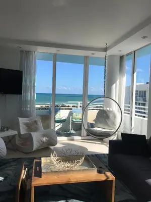 a living room with a view of the ocean at Dream Destinations at Ocean Place in Miami Beach