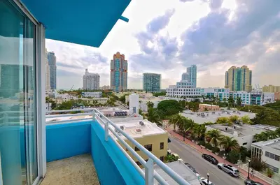 a balcony with a view of a city at Dream Destinations at Ocean Place in Miami Beach