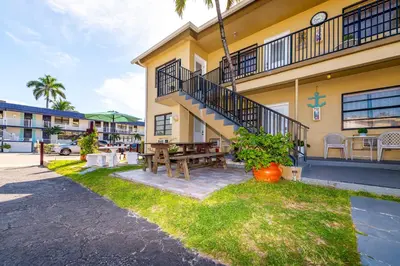 a building with a picnic table in front of it at Tropic Isle Hotel & Apartment in Hollywood