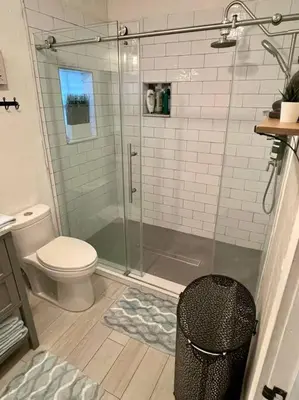 a bathroom with a shower with a toilet and a trashcan at Taste of Miami Vive in Miami
