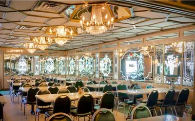a large room with tables and chairs and chandeliers at Gorgeous Private Room, near the Airport - Free parking - 01 in Miami