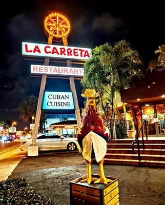 a statue of a woman sitting on a box in front of a restaurant at Gorgeous Private Room, near the Airport - Free parking - 01 in Miami