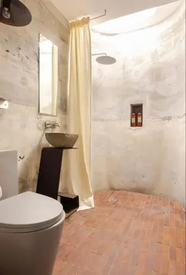 a bathroom with a toilet and a sink at Casa Ishi - at lumicollection in Miami