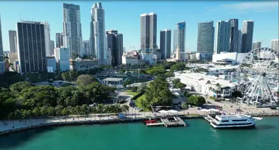 a city skyline with a ferris wheel and a harbor at Cute Private Room - Close to airport & Free parking 01 in Miami