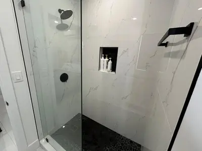 a bathroom with a shower with a glass door at Cute Private Room - Close to airport & Free parking 01 in Miami
