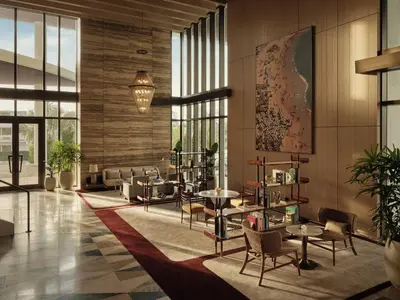 a lobby with tables and chairs and large windows at Four Seasons Hotel and Residences Fort Lauderdale in Fort Lauderdale