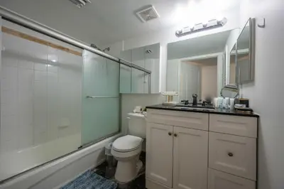 a bathroom with a toilet and a sink and a shower at LUXURY 3 Bedrooms BRICKELL BAY APARTMENT in Miami