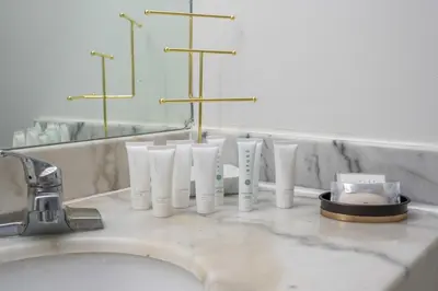 a row of white toothbrushes sitting on a bathroom sink at LUXURY 3 Bedrooms BRICKELL BAY APARTMENT in Miami