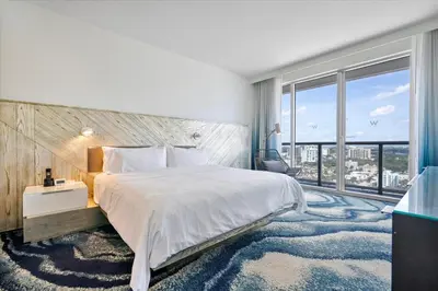 a bedroom with a large bed and a large window at W Residences 2 Bedroom Suite condo in Fort Lauderdale