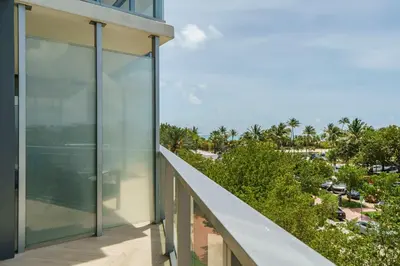 an external view of a glass building with a balcony at W SOUTH BEACH Residences Private King Studio in Miami Beach