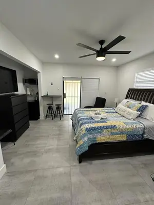 a bedroom with a bed and a ceiling fan at LYZ Miami in Miami